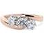 Picture of A unique Round Brilliant Cut three stone diamond ring in 18ct rose & white gold
