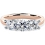 Picture of An elegant Round Brilliant Cut three stone diamond ring in 18ct rose & white gold