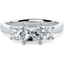 Picture of A striking Princess & Round Brilliant Cut three stone diamond ring in 18ct white gold