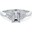 Picture of A classic Emerald Cut diamond ring with small Round shoulder stones in 18ct white gold